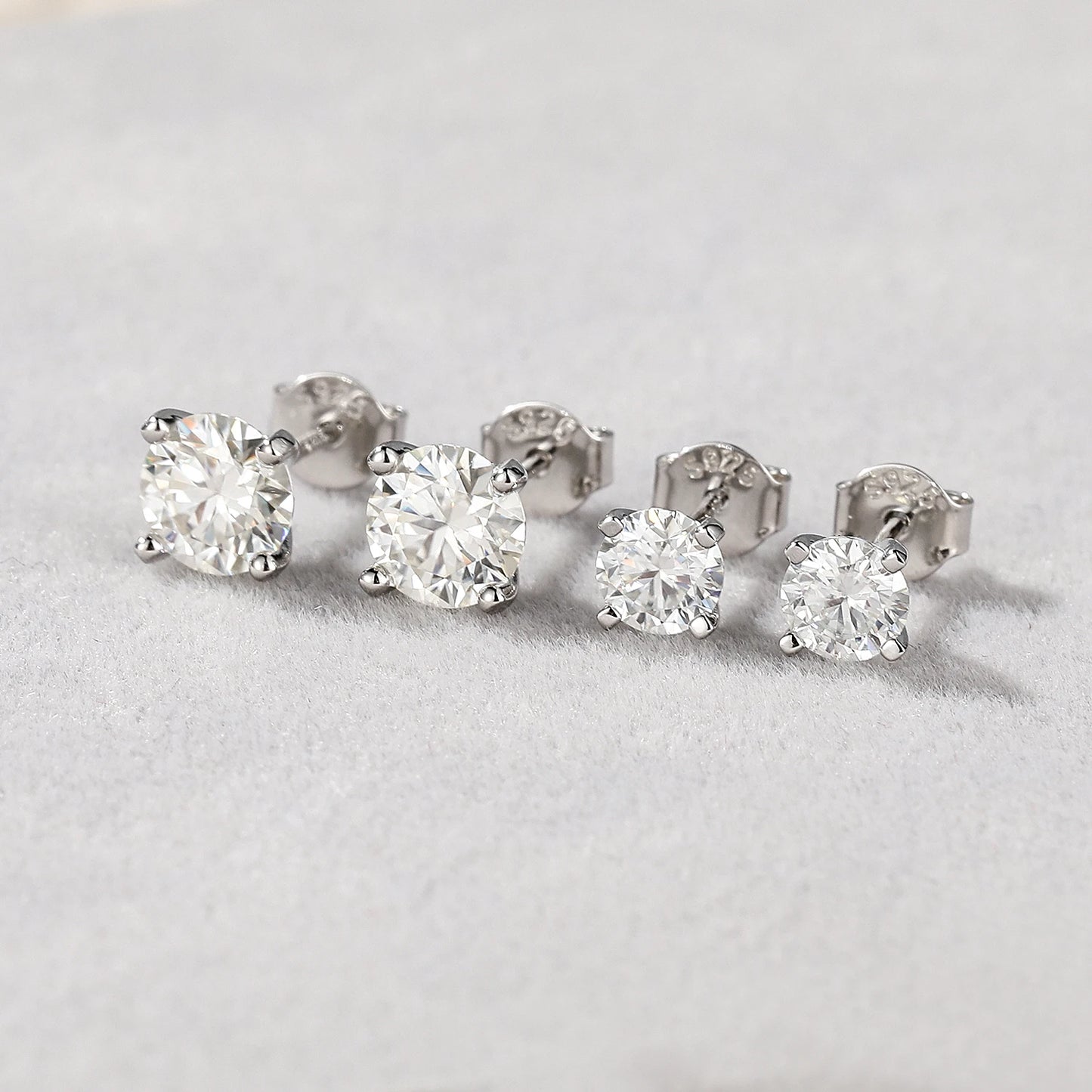 "The Stellar Solitaire: D-Class Moissanite Studs in Sterling Silver"